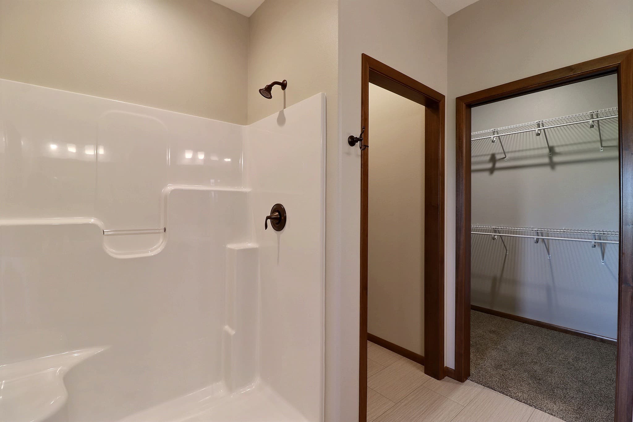 Walk-in shower with adjoining walk-in closet in an RHC master suite